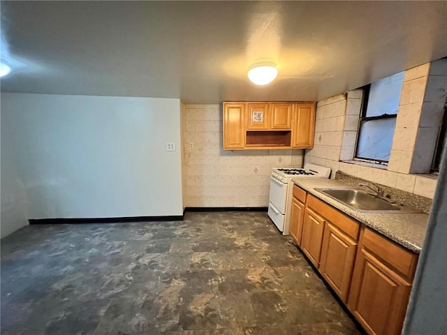 622 Ocean View Ave, Brooklyn, NY 11235 - kitchen featuring a sink, white range with gas cooktop, brown cabinets, and concrete floors