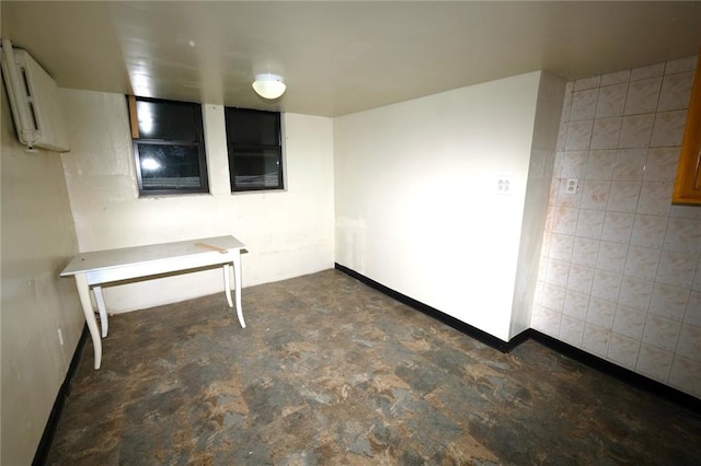 622 Ocean View Ave, Brooklyn, NY 11235 - empty room with baseboards and concrete floors