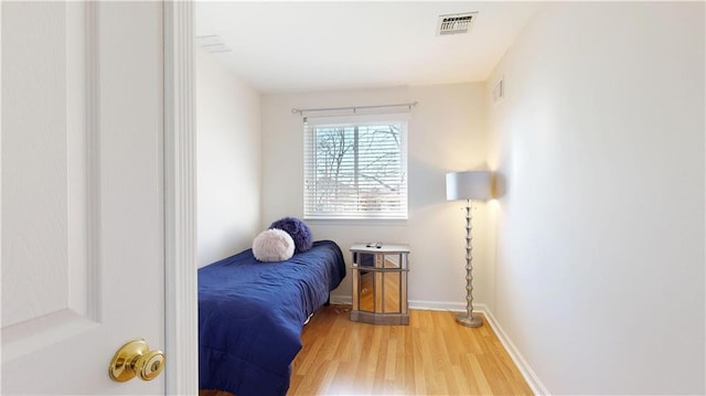 bedroom with wood-type flooring