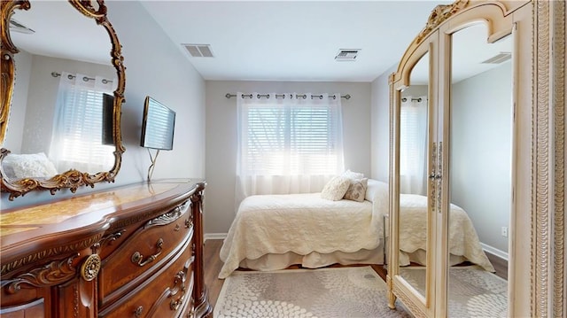 bedroom with hardwood / wood-style floors