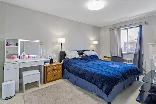 bedroom with light colored carpet