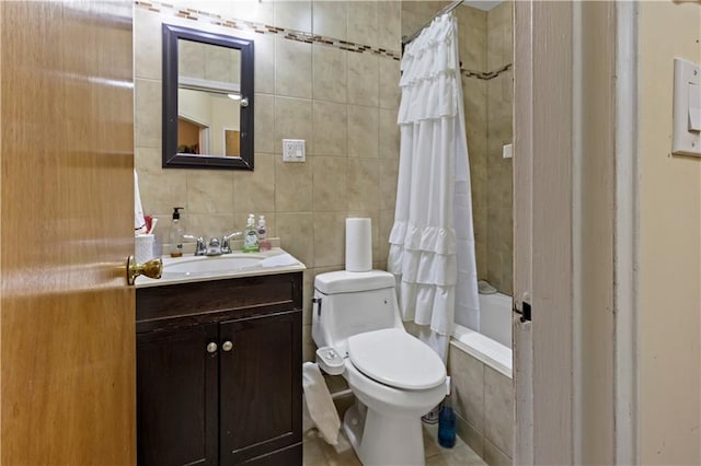 full bathroom featuring backsplash, tile walls, vanity, shower / tub combo, and toilet