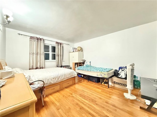 bedroom featuring wood finished floors