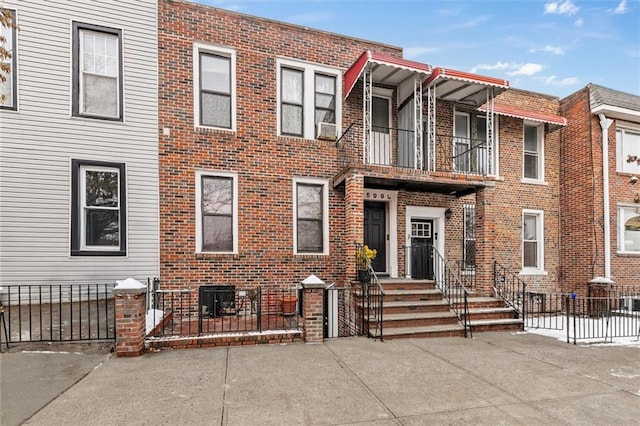 view of property with brick siding