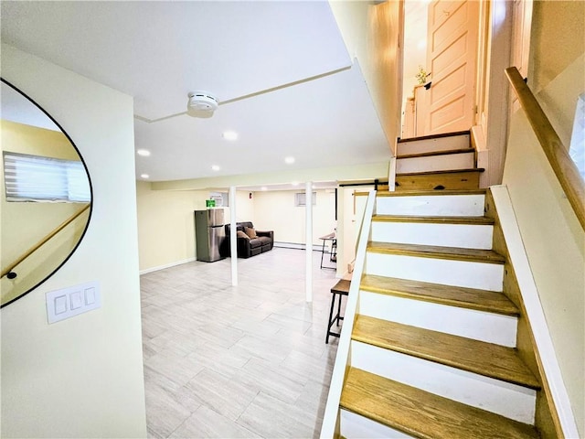 staircase with baseboards and recessed lighting
