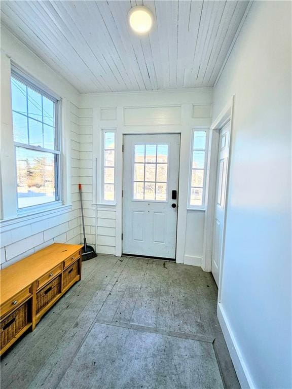 doorway to outside with wooden ceiling