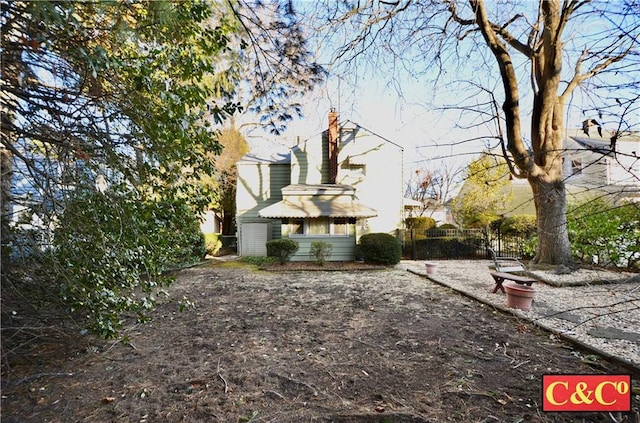 view of property exterior featuring fence