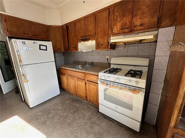 kitchen with decorative backsplash, brown cabinetry, a sink, white appliances, and under cabinet range hood