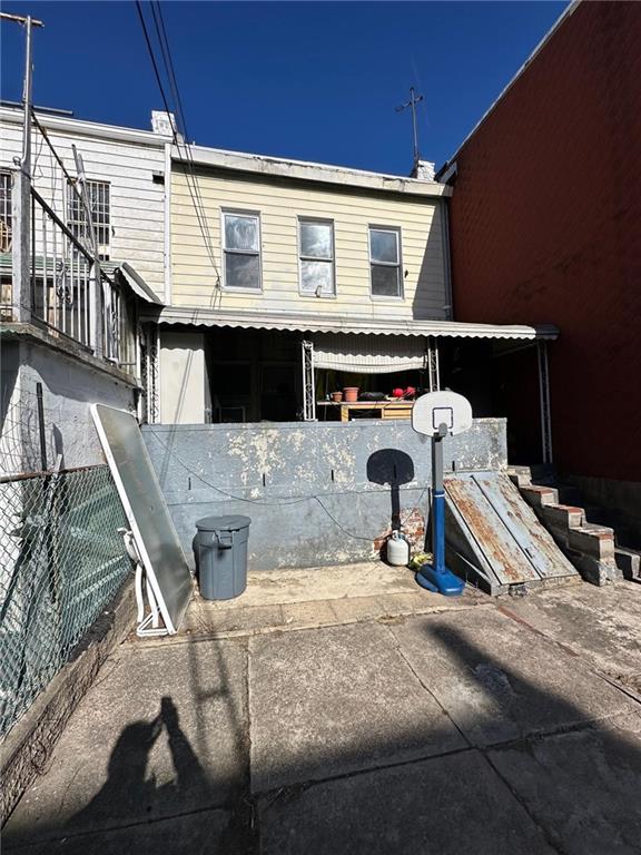 back of property with fence