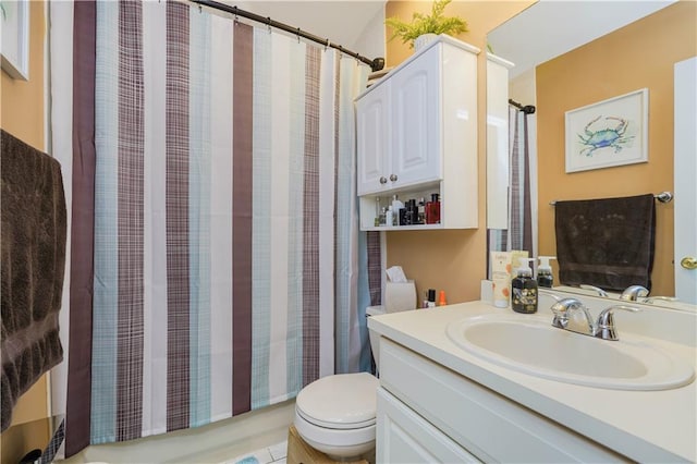 bathroom featuring toilet and vanity