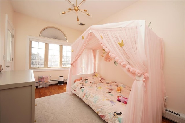 bedroom featuring a baseboard radiator, lofted ceiling, visible vents, wood finished floors, and a chandelier