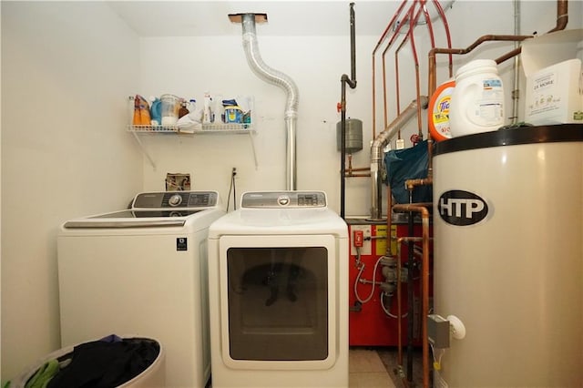 laundry room with laundry area, gas water heater, and washer and dryer