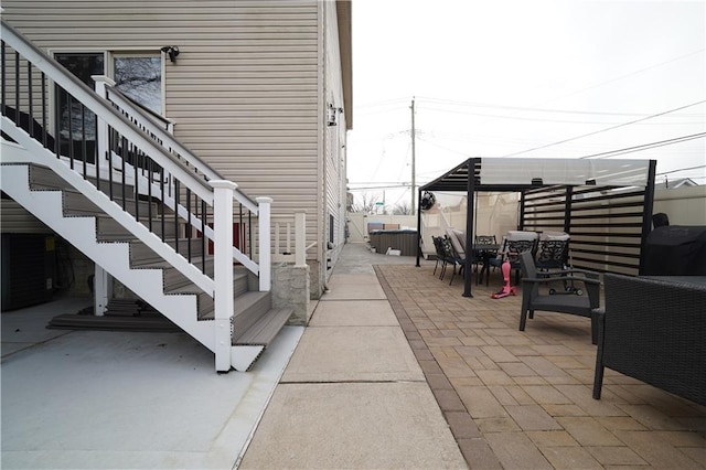 view of patio / terrace featuring stairway and outdoor dining space