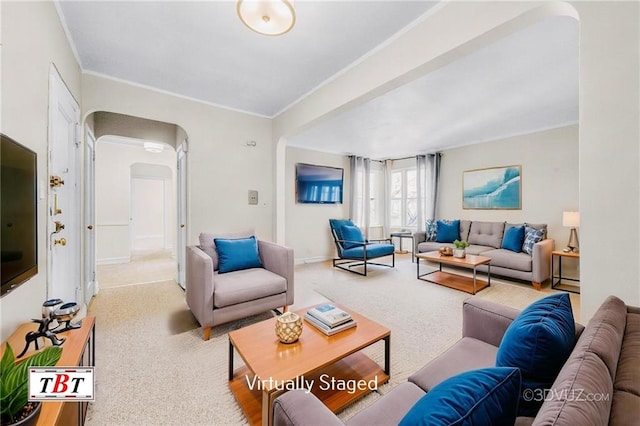 1615 I Ave Unit 511, Brooklyn, NY 11230 - living room with carpet, arched walkways, crown molding, baseboards, and a baseboard heating unit