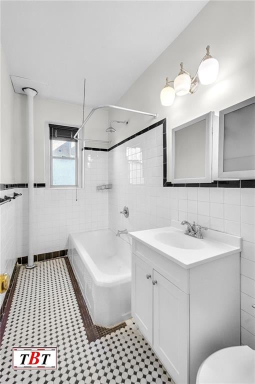 1615 I Ave Unit 511, Brooklyn, NY 11230 - full bath featuring tile walls, vanity, shower / tub combination, toilet, and wainscoting