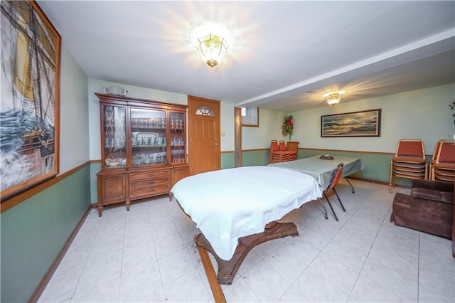 playroom with light tile patterned flooring and baseboards