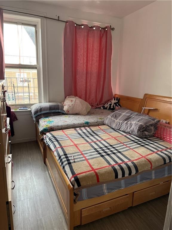 bedroom with wood finished floors