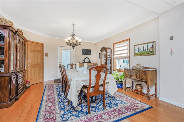 1265 86th St, Brooklyn, NY 11228 - dining room featuring a chandelier, light wood-type flooring, and crown molding