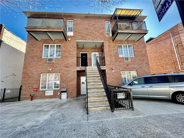 view of building exterior featuring stairs