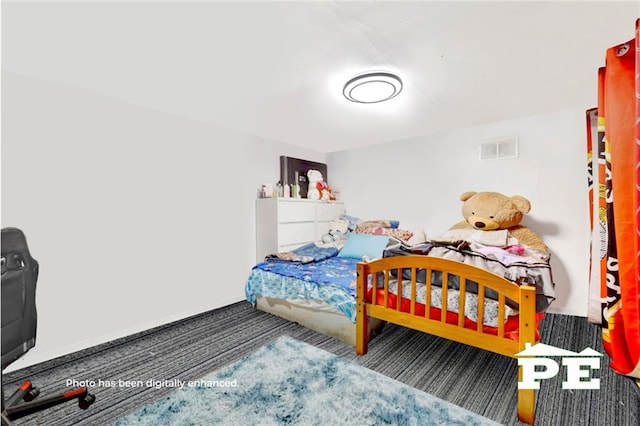 bedroom featuring visible vents and carpet flooring