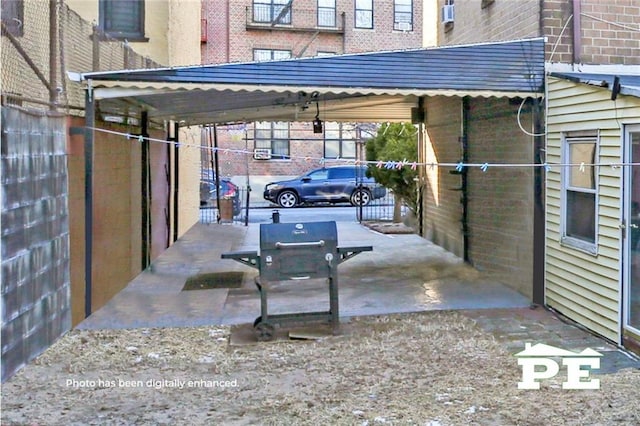 view of car parking featuring a carport and fence