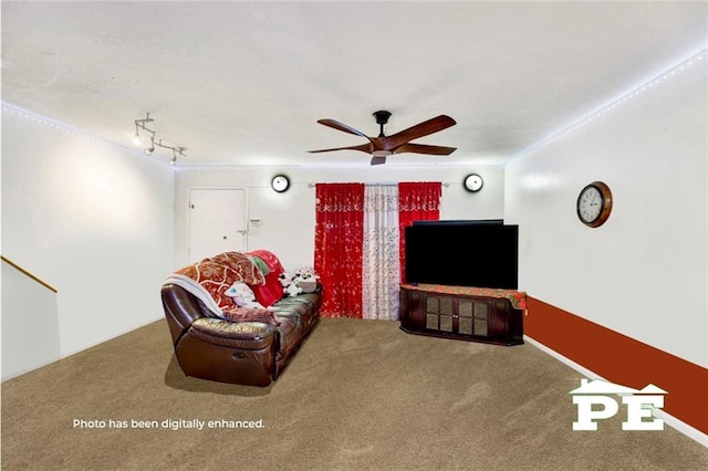 carpeted living area featuring ceiling fan