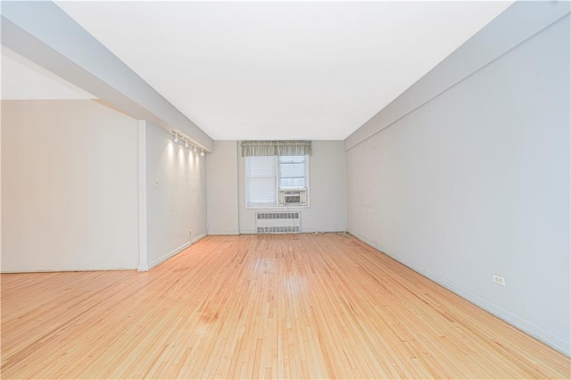 9707 4th Ave Unit 4W, Brooklyn, NY 11209 - unfurnished room with radiator and hardwood / wood-style floors