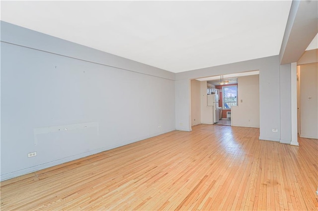 9707 4th Ave Unit 4W, Brooklyn, NY 11209 - spare room featuring light wood-type flooring and baseboards