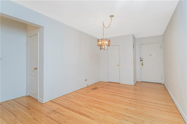 9707 4th Ave Unit 4W, Brooklyn, NY 11209 - unfurnished room featuring light wood-style flooring and a chandelier