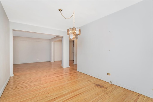 9707 4th Ave Unit 4W, Brooklyn, NY 11209 - unfurnished room with a chandelier and light wood-style flooring
