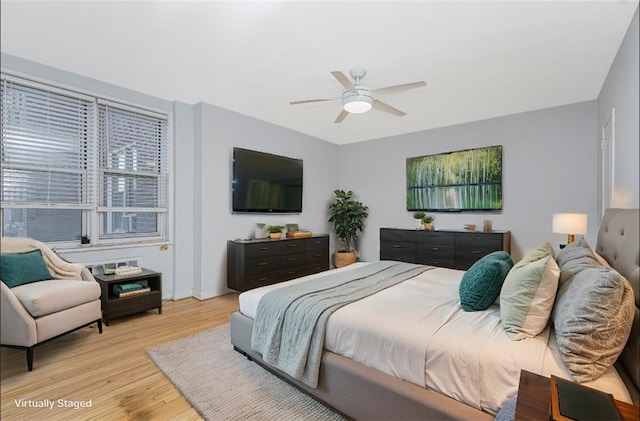 9707 4th Ave Unit 4W, Brooklyn, NY 11209 - bedroom with light wood-type flooring and a ceiling fan