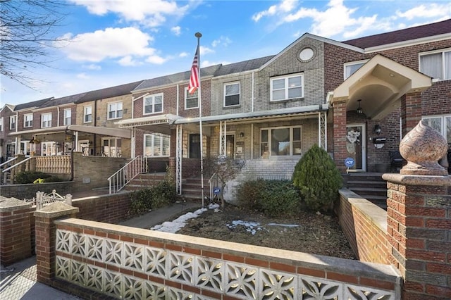 view of property with brick siding and a residential view