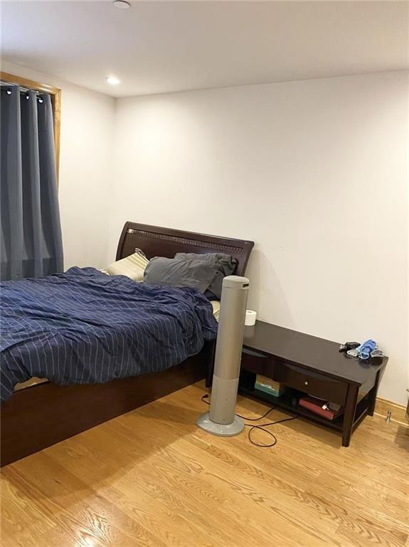 bedroom featuring recessed lighting and light wood-style flooring