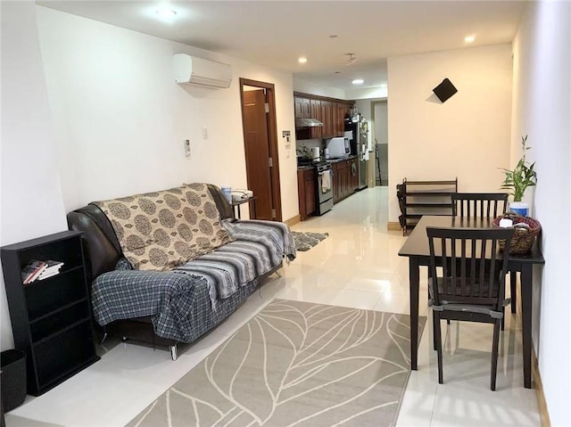 living area with light tile patterned floors, an AC wall unit, and recessed lighting