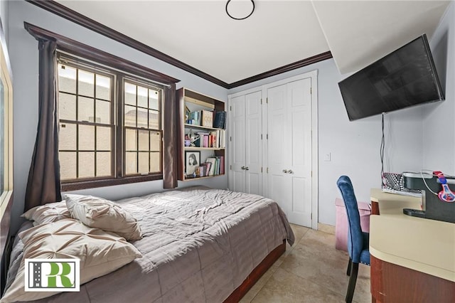 bedroom with two closets, light tile patterned floors, and crown molding