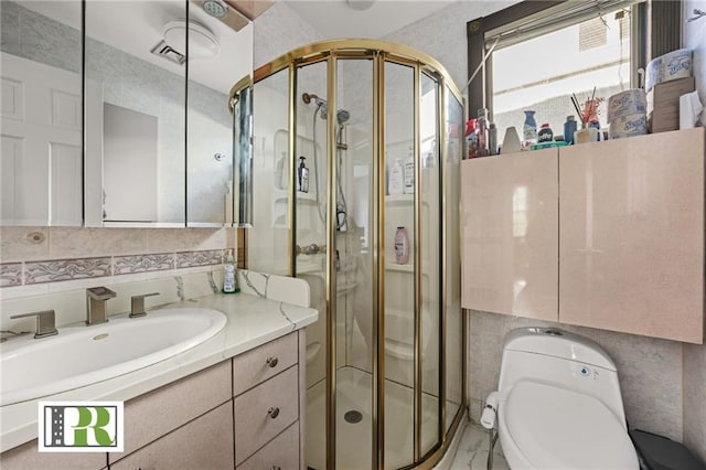 full bath featuring tile walls, a shower stall, and toilet