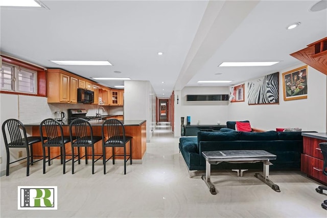 living area featuring recessed lighting and finished concrete floors