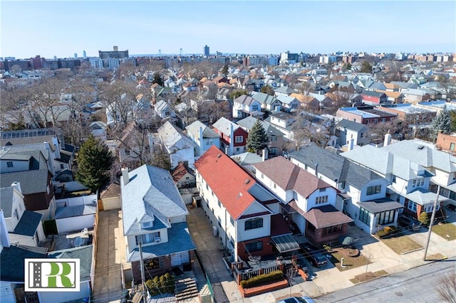 birds eye view of property with a residential view