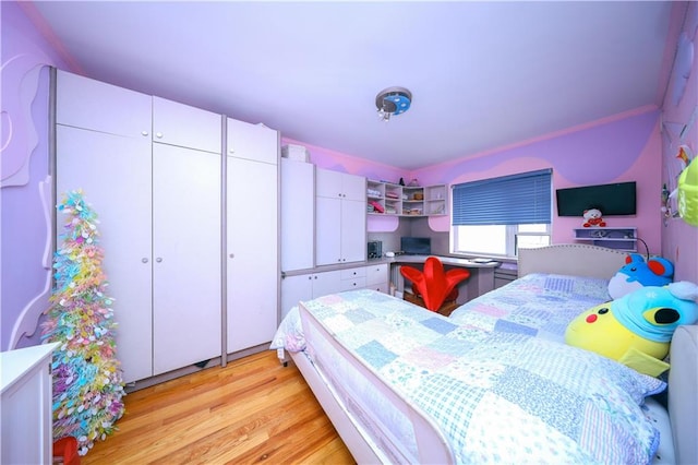 bedroom with light wood-style floors