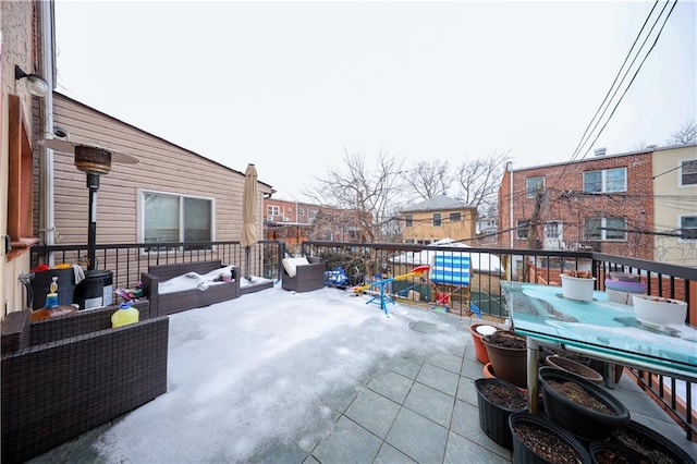 view of patio featuring a playground and an outdoor living space