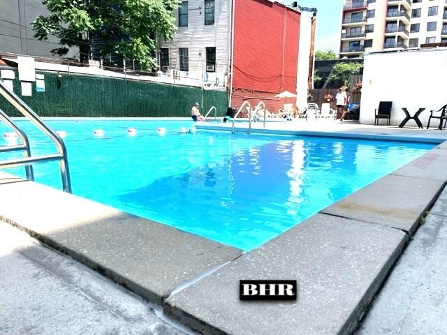 1625 Emmons Ave Unit 6T, Brooklyn, NY 11235 - community pool featuring a patio area