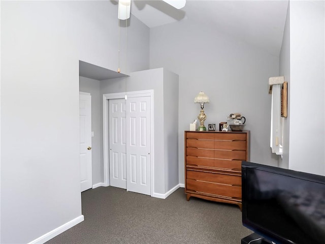 living area with high vaulted ceiling, dark colored carpet, ceiling fan, and baseboards