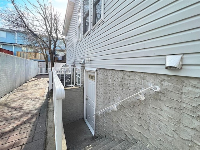 view of property exterior with fence