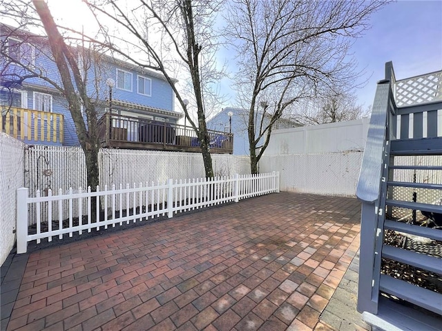 view of patio / terrace with a fenced front yard