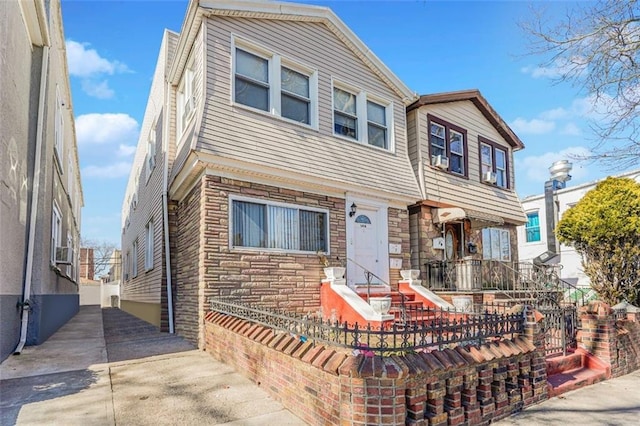 multi unit property featuring stone siding