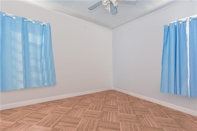 unfurnished room featuring crown molding, baseboards, and a ceiling fan