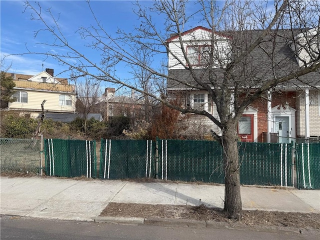 view of gate featuring fence