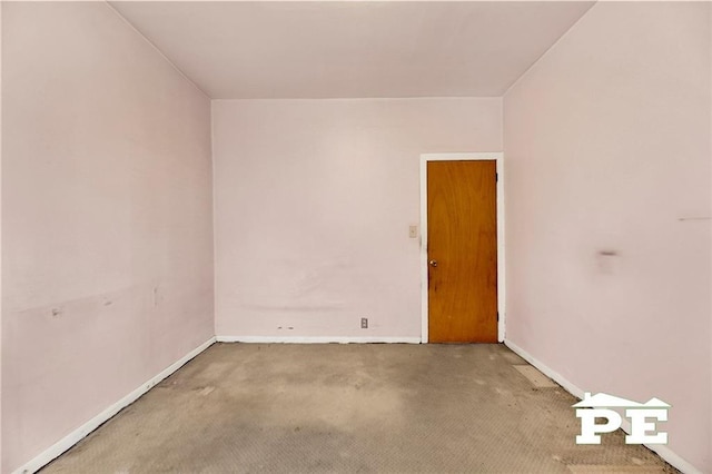 carpeted empty room with baseboards