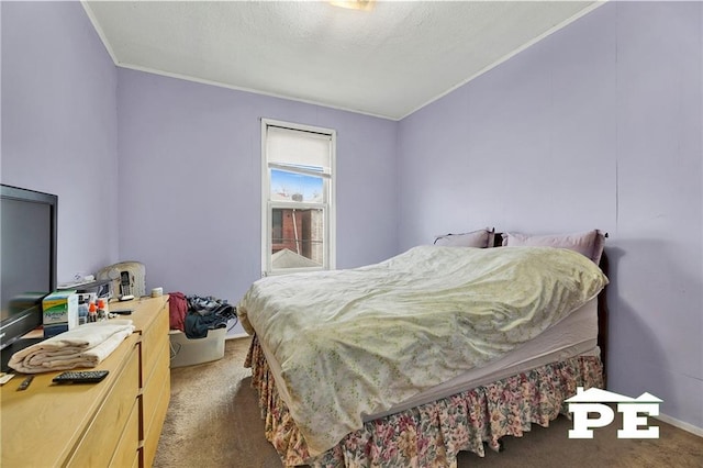 carpeted bedroom with crown molding and a textured ceiling