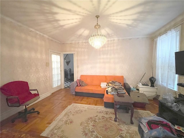 living area featuring a healthy amount of sunlight and baseboards